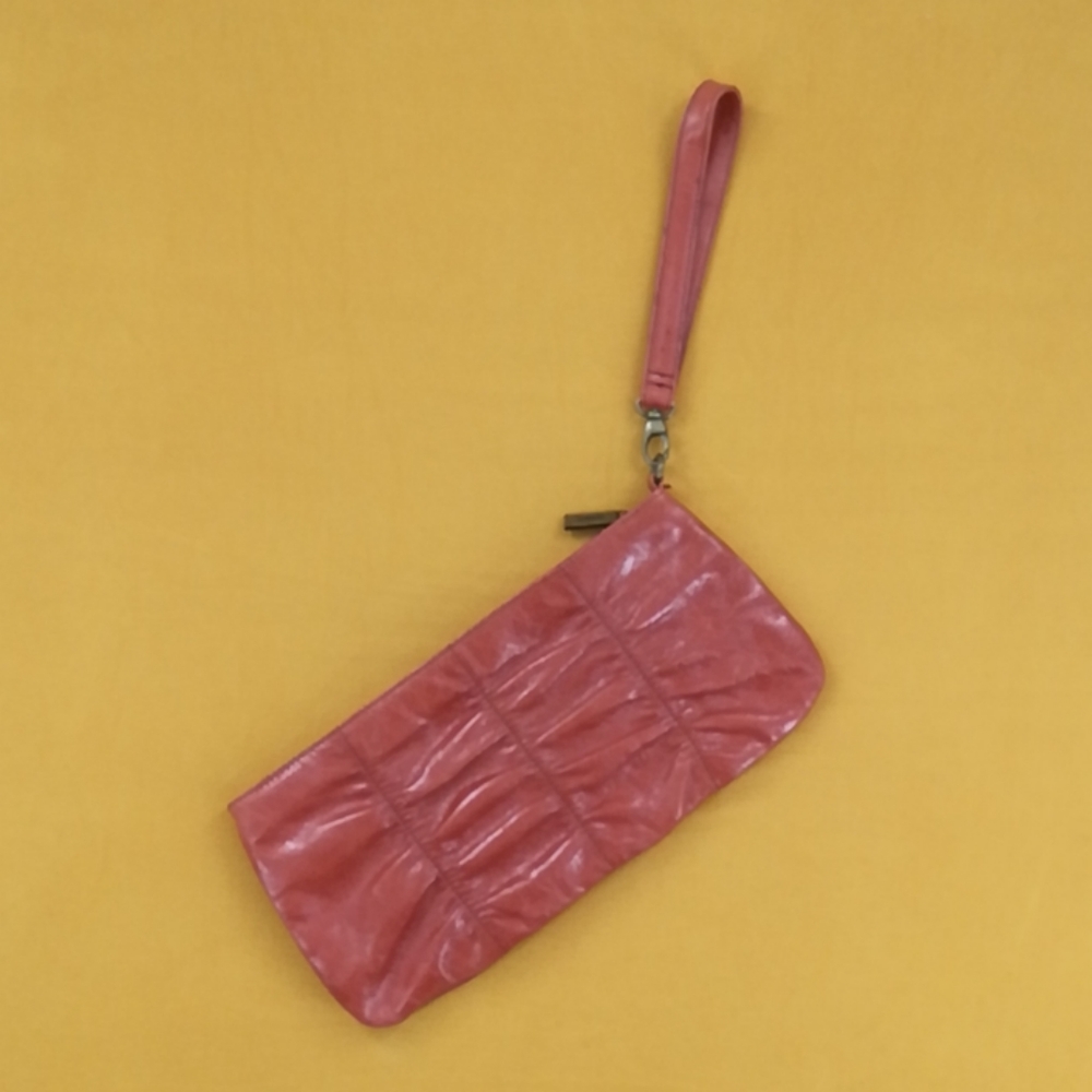 Hobo International rust orange leather clutch